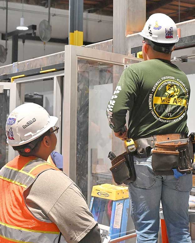photo-of-glaziers-training-glass-doors